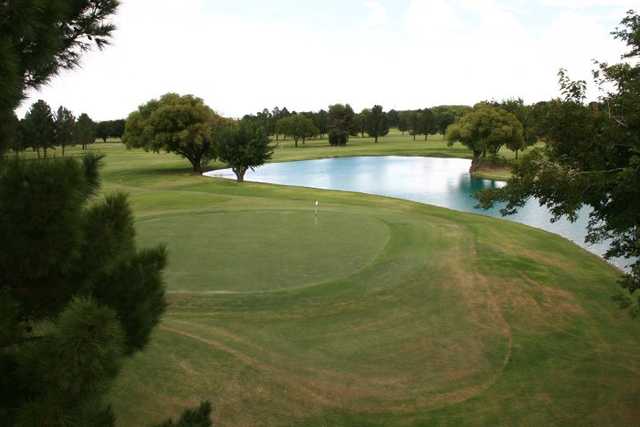 A view of a green with water coming into play at Lone Star Golf Course