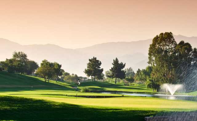 A view of a green with water coming into play from Pines At Clermont