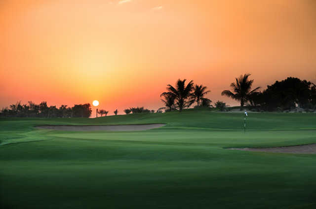 A view of a green protected by sand traps at Abu Dhabi Golf Club
