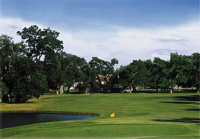 A view of a green with water coming into play at Legendary Oaks Golf Course
