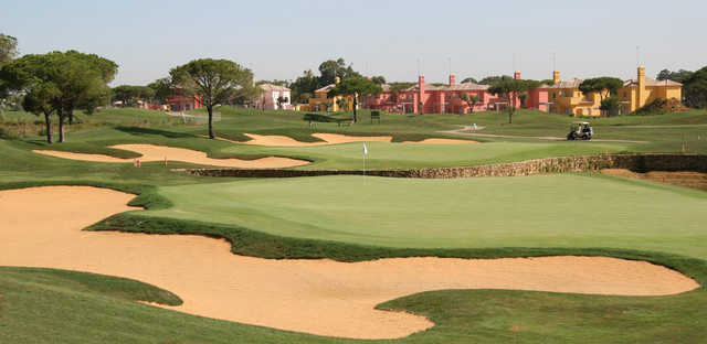 A view of two greens protected by bunkers at Sancti Petri Hills Golf.