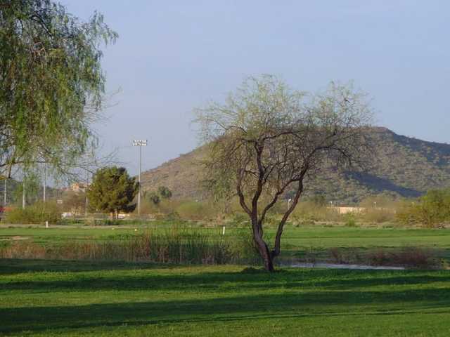 A view over a pond from Adobe Dam Family Golf Center