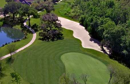 Aerial view of a green protected by a bunker from The Club at Eaglebrooke