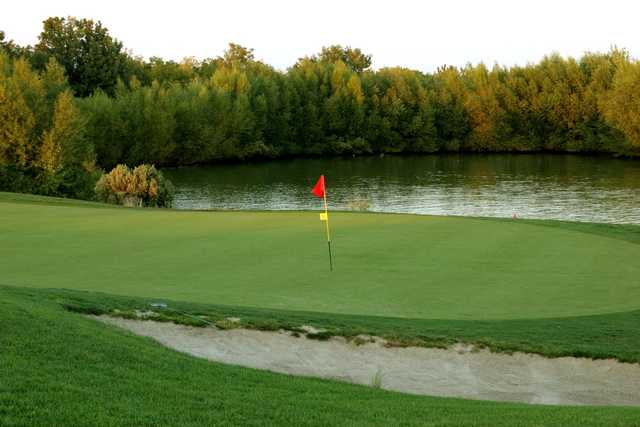 A view of a green with water coming into play at Wildhorse Golf Course