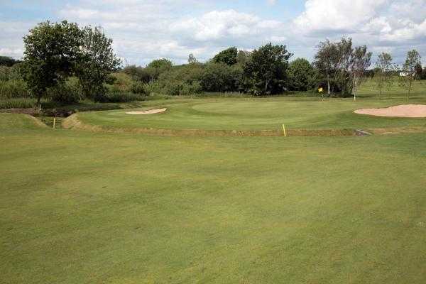 A view of green #14 flanked by bunkers at Heysham Golf Club