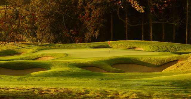 A view of the 15th green protected by a collection of sand traps at Killeen Castle Golf Club