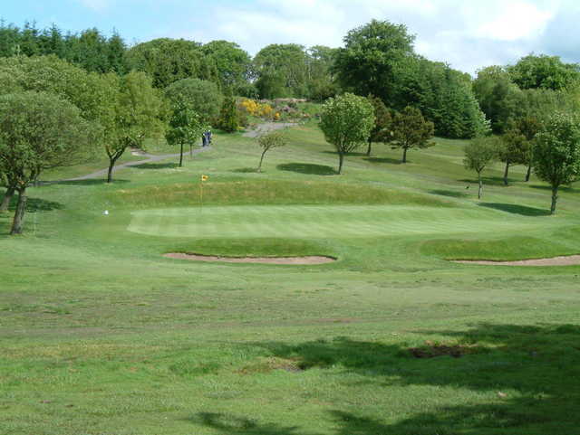 A view of the 2nd hole with a narrow path on the left side at Windyhill Golf Club