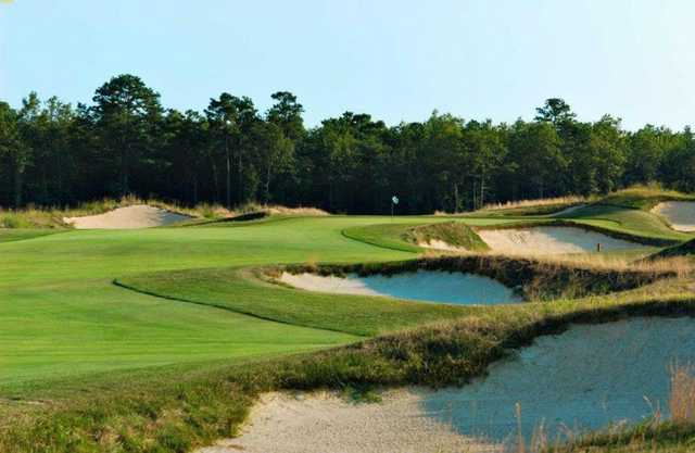 A view of the 7th green protected by sand traps at Twisted Dune Golf Club