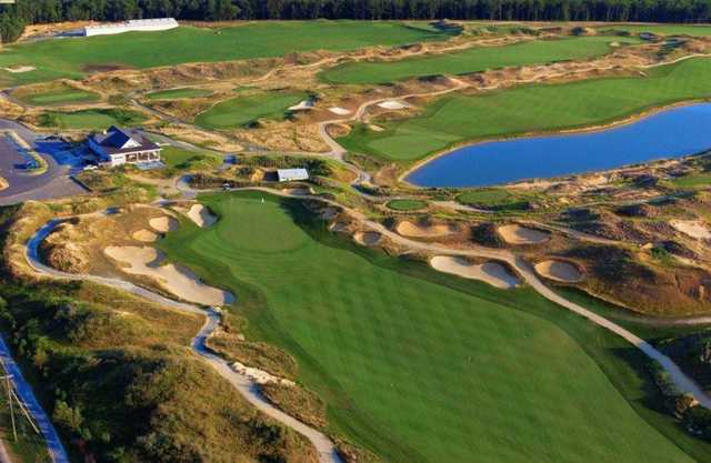 Aerial view of the fun green #18 and the clubhouse at Twisted Dune Golf Club