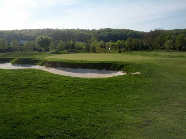 A view of a green protected by an undulating bunker at Raspberry Falls Golf & Hunt Club (Tyler Dunmyer)