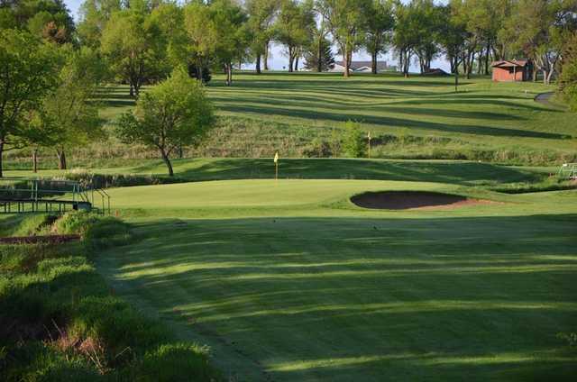 A sunny day view from the left side of a fairway at Madison Golf & Country Club