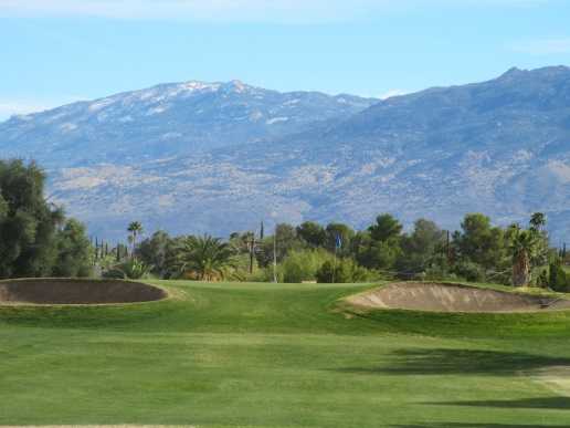 A view of a green flanked by sand traps at Rolling Hills Golf Course