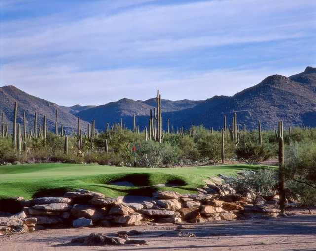 A view of a green protected by sand traps at Gallery Golf Club