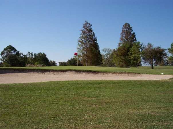 View of a hole and bunker at Bayou Barriere Golf Club