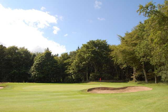 A view of a green flanked by bunkers at McDonald Golf Club