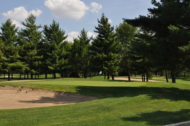 A view of a green protected by sand traps at White Pines Golf Course