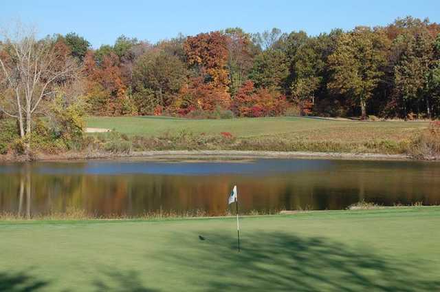 A fall view of a hole with water coming into play at The Woodlands Course at Whittaker