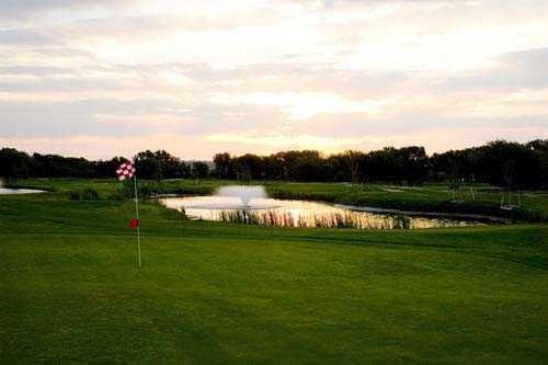 A view of a hole with water in background at Spring Valley Golf Course