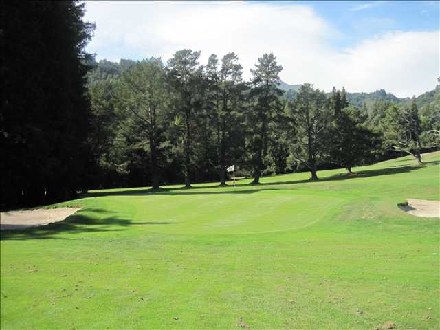 A view of the 5th hole flanked by sand traps at Mill Valley Golf Course