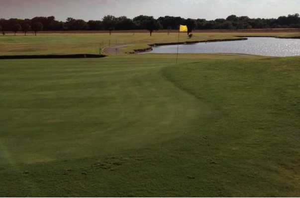 A view of a hole with water coming into play at Kingfisher Golf Course