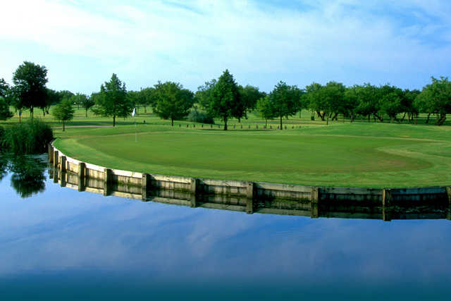 A view over the water of a green at Prairie Lakes Golf Course