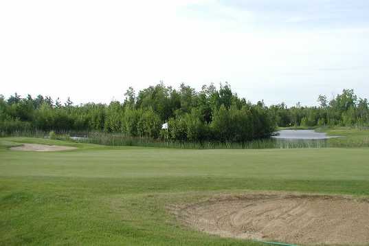 A view of hole #8 with water in background at Adirondack Golf & Country Club