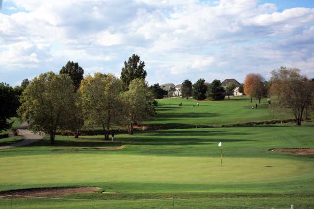 A view of a green protected by sand traps at Hickory Point Golf Course