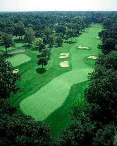 #8 features a lovely cross bunker in the middle of the fairway about eighty yards from the green. The second shot is to a smallish, two-tiered green with a collection area at the middle-left section and out of bounds left of the green.