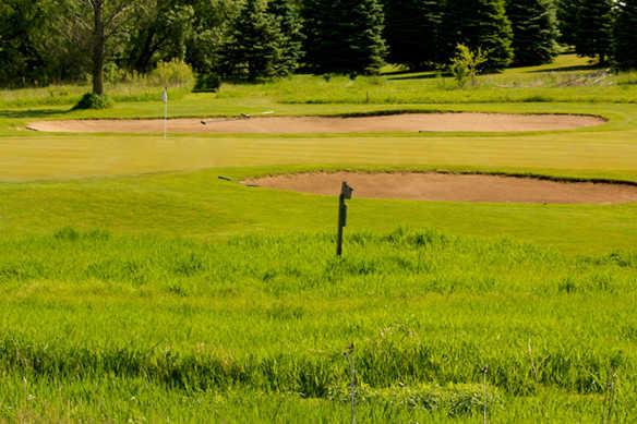 A view of a hole protected bunkers at Redtail Golf Club