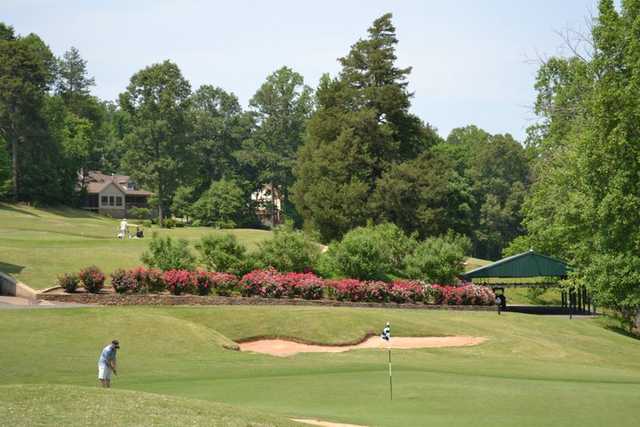 A view of a hole protected by bunkers at Cleghorn Golf & Sports Club.