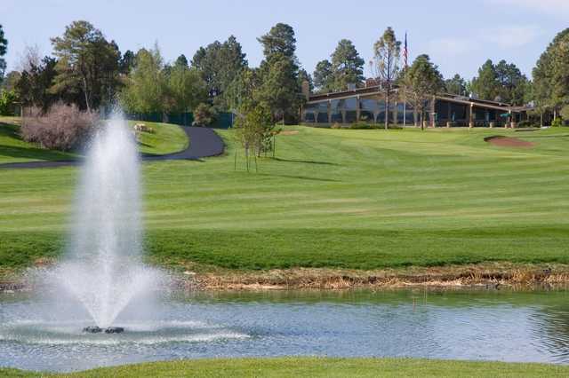 A view of a fairway with a water fountain in foreground at Continental Country Club