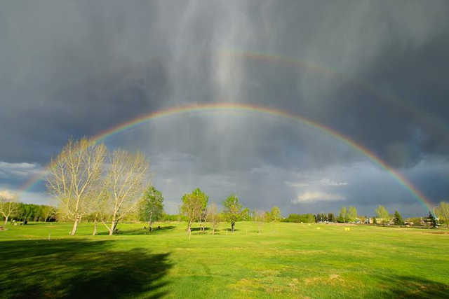 A view of a rainbow over Wainwright Golf and Country Club
