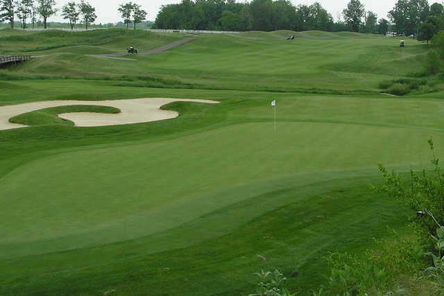 A view of a hole with an undulating bunker on the left side at Bear Slide Golf Club