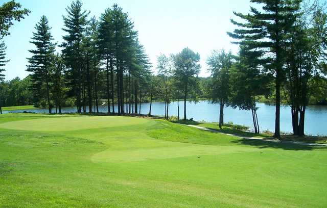 A view of a green with water in background at Boonville Country Club