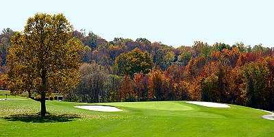 A view of a green flanked by bunkers at Twin Lakes