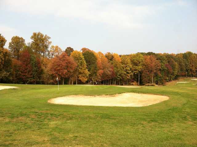 A fall view of a green at Severna Park Golf Center