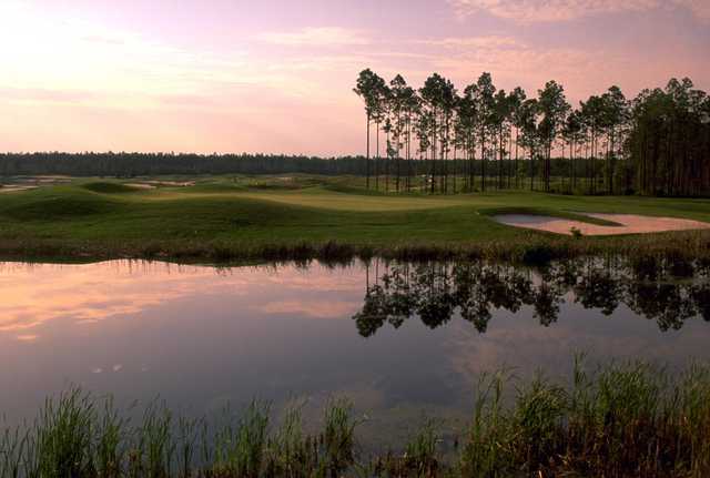 A view of a green with water and bunkers coming into play at Lakes Golf Course from Laura Walker State Park