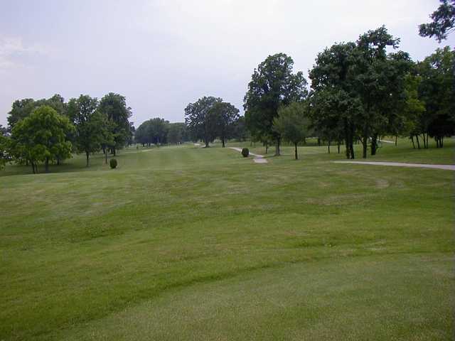 A view of a fairway with a narrow path at Rolling Hills Golf Course