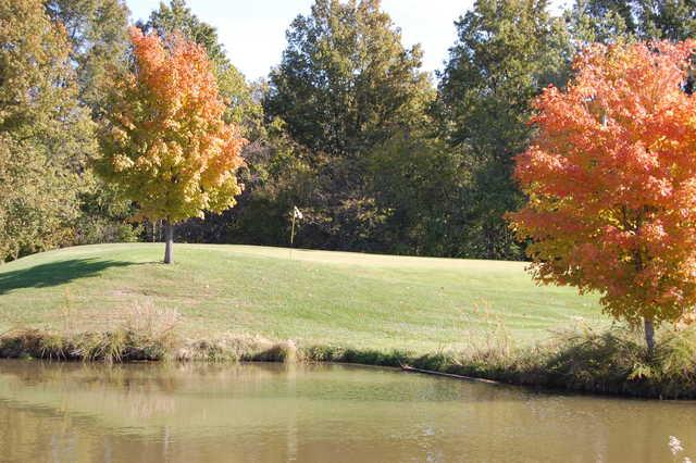 A view over the water of a hole at Par 3 from Governors Run Golf & Country Club