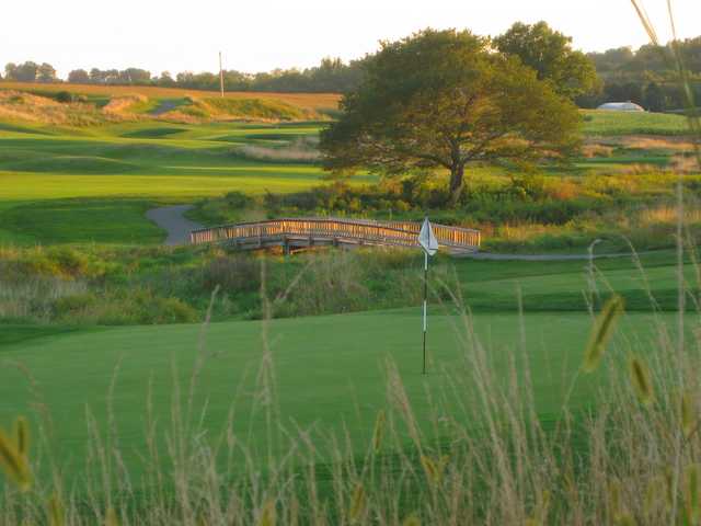 A view of a hole with a bridge in background at Wyncote Golf Club