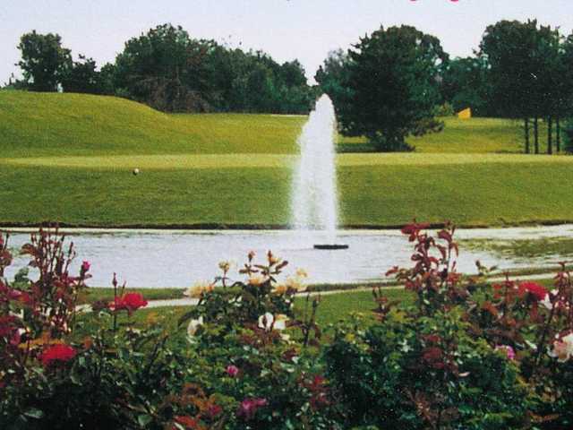 A view over the water of a green at Island Lake Golf & Training Center