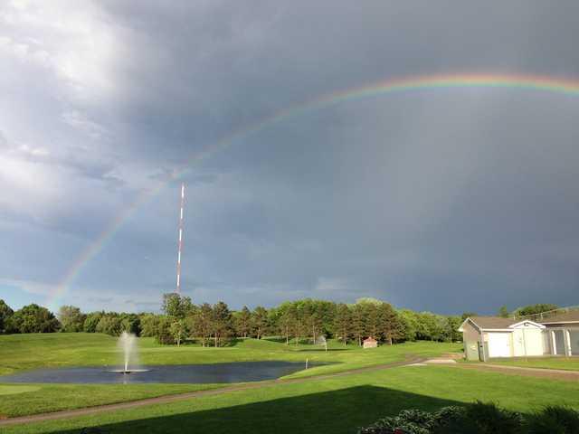 A rainbow over Island Lake Golf & Training Center