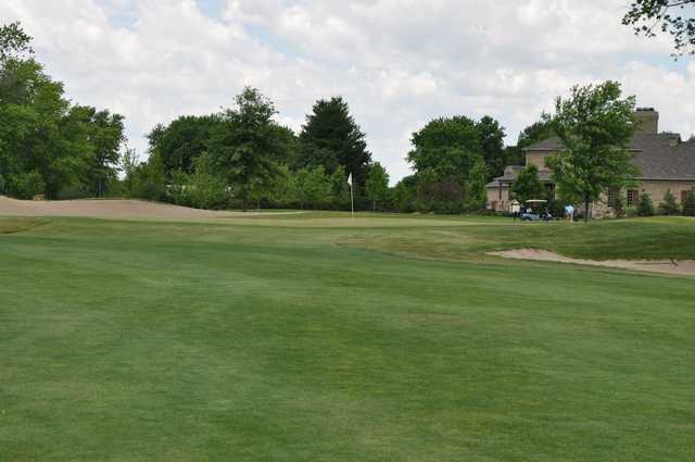 A view of a hole flanked by sand traps at Hawk's Tail of Greenfield