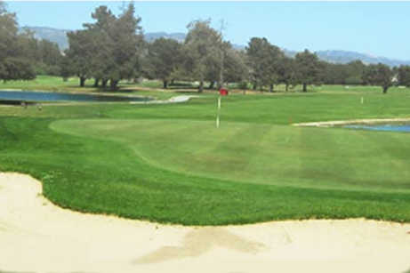 A view of a hole with water and a bunker coming into play at Salinas Fairways Golf Course