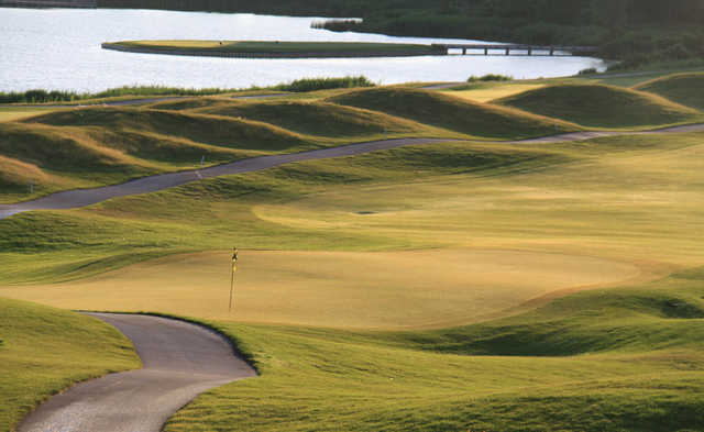 A sunny view of a hole at Lost Marsh Golf Course