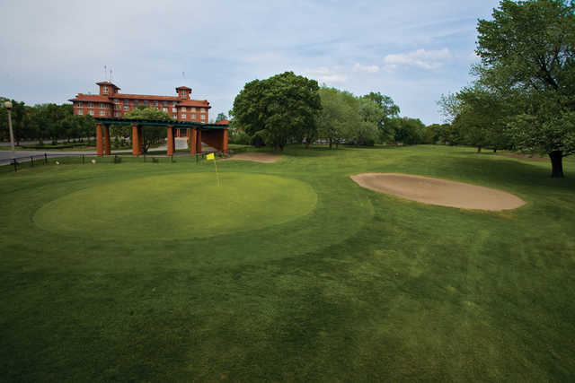 A view of a green protected by bunkers at Jackson Park Golf Club