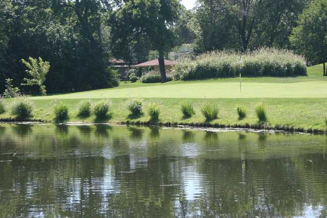 A sunny day view of a hole at Flag Creek Golf Course