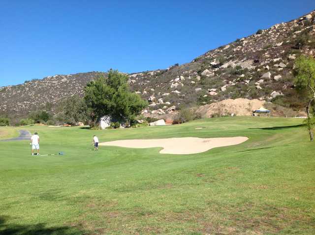 A view of a green protected by a bunker at Welk Resort San Diego
