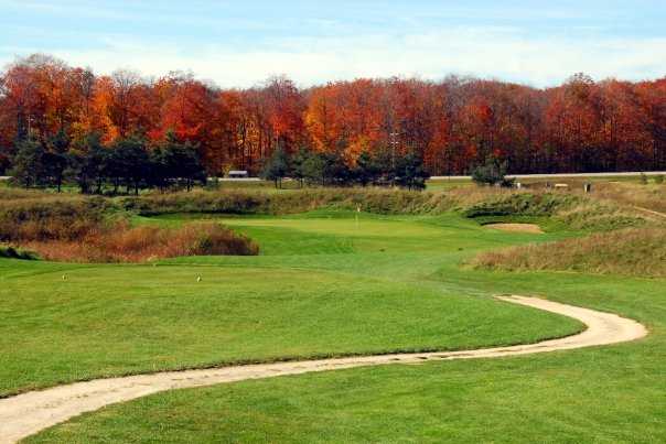 A fall view of a tee at Northern Dunes Golf Club