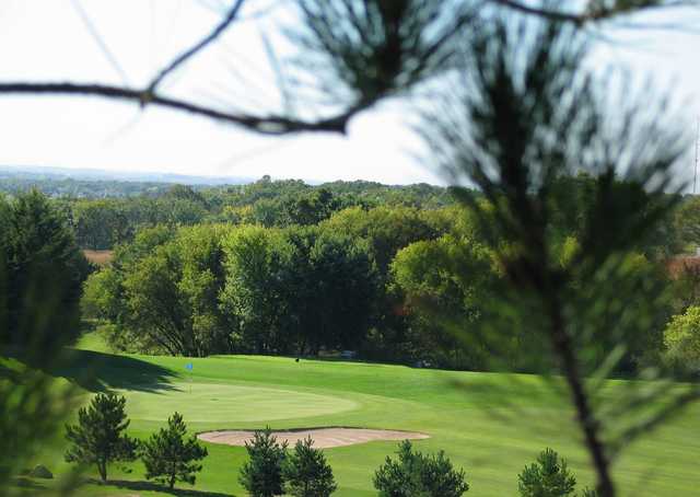 A view of a green protected by a bunker at Afton Alps Golf Course